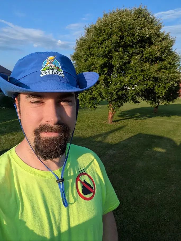 Lightning Scoopers technician performing dog poop scooping in Livingston County NY